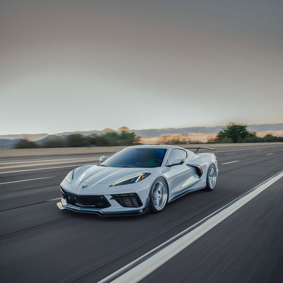 White Corvette C8 Stingray with RSC ST Front Splitter driving in dessert